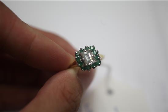 A 1980s 18ct gold, diamond and emerald cluster ring, size L.